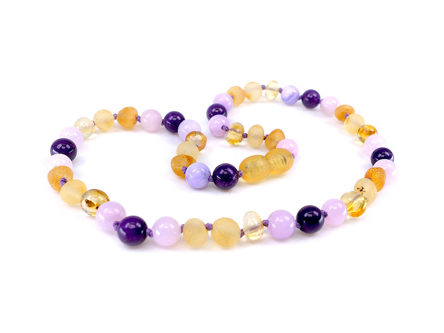 Accesorio de dentición ecológico con ámbar natural y piedras semipreciosas en tonos rosa y púrpura