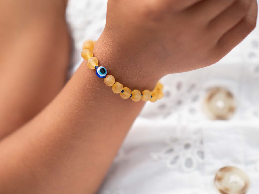 Pulsera de dentición natural de ámbar báltico miel con ojo turco para bebés
