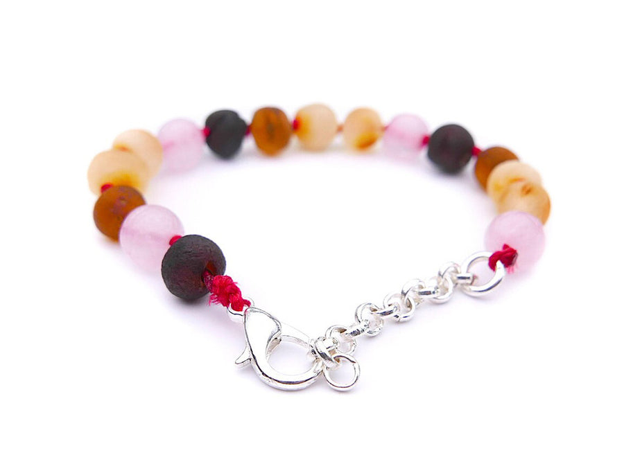 Accesorio natural de ámbar crudo y cuarzo rosa para calmar molestias de dentición
