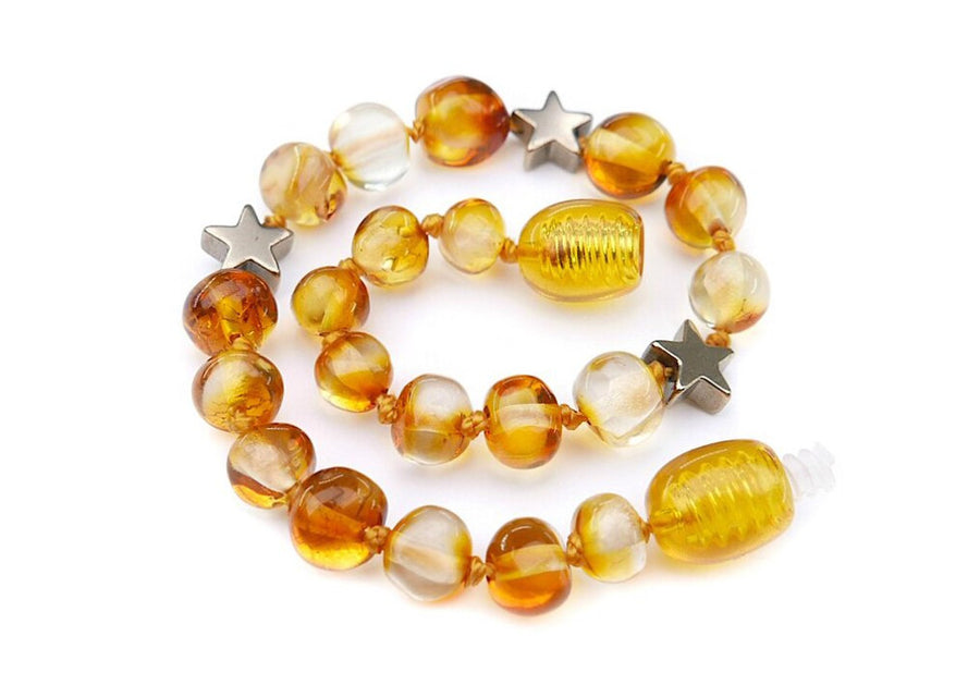 Pulsera calmante de ámbar báltico pulido y estrella de hematita para bebés