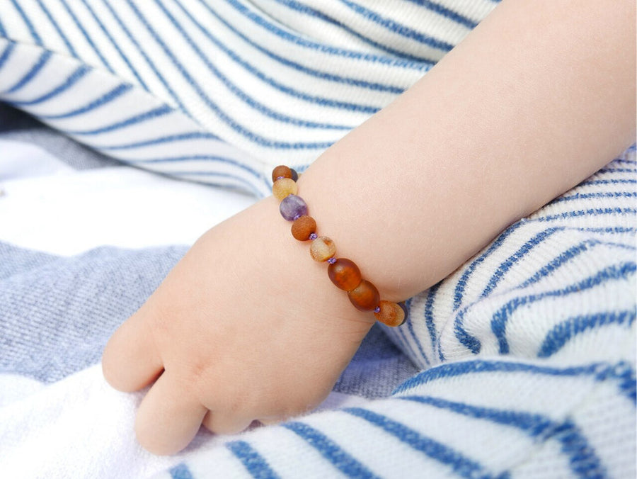 Tobillera de ámbar y amatista, joyería natural para la dentición infantil