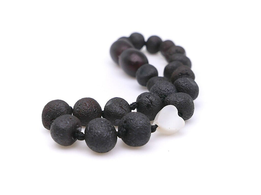 Pulsera elástica de ámbar báltico color cereza oscura con perla para bebés