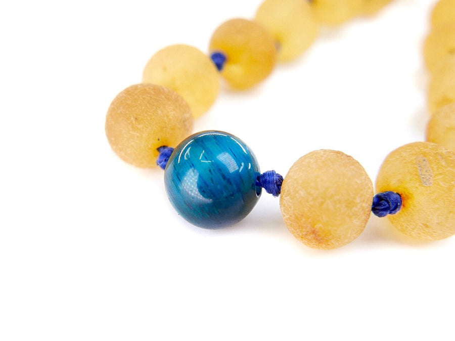Pulsera calmante de ámbar báltico y ojo de tigre para bebés