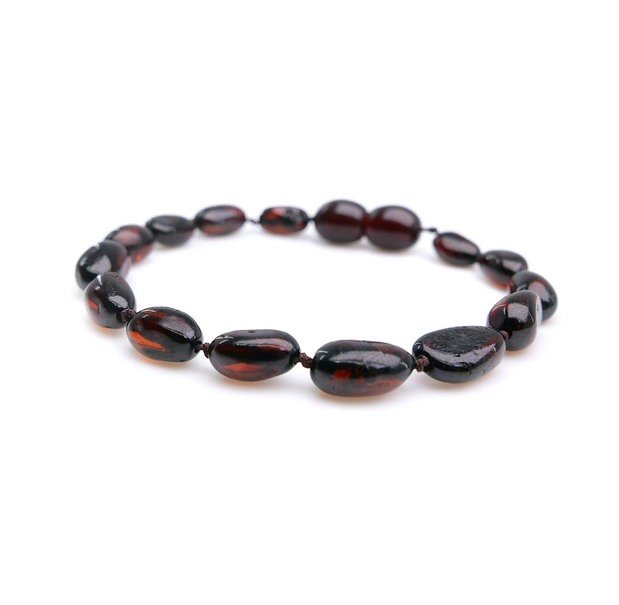 Accesorio de dentición natural con ámbar cereza oscura pulido