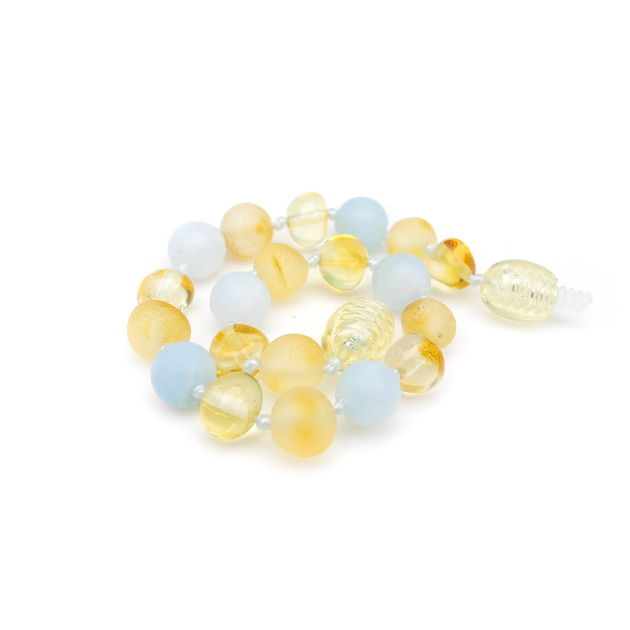 Joyería natural para dentición con ámbar miel y aguamarina azul