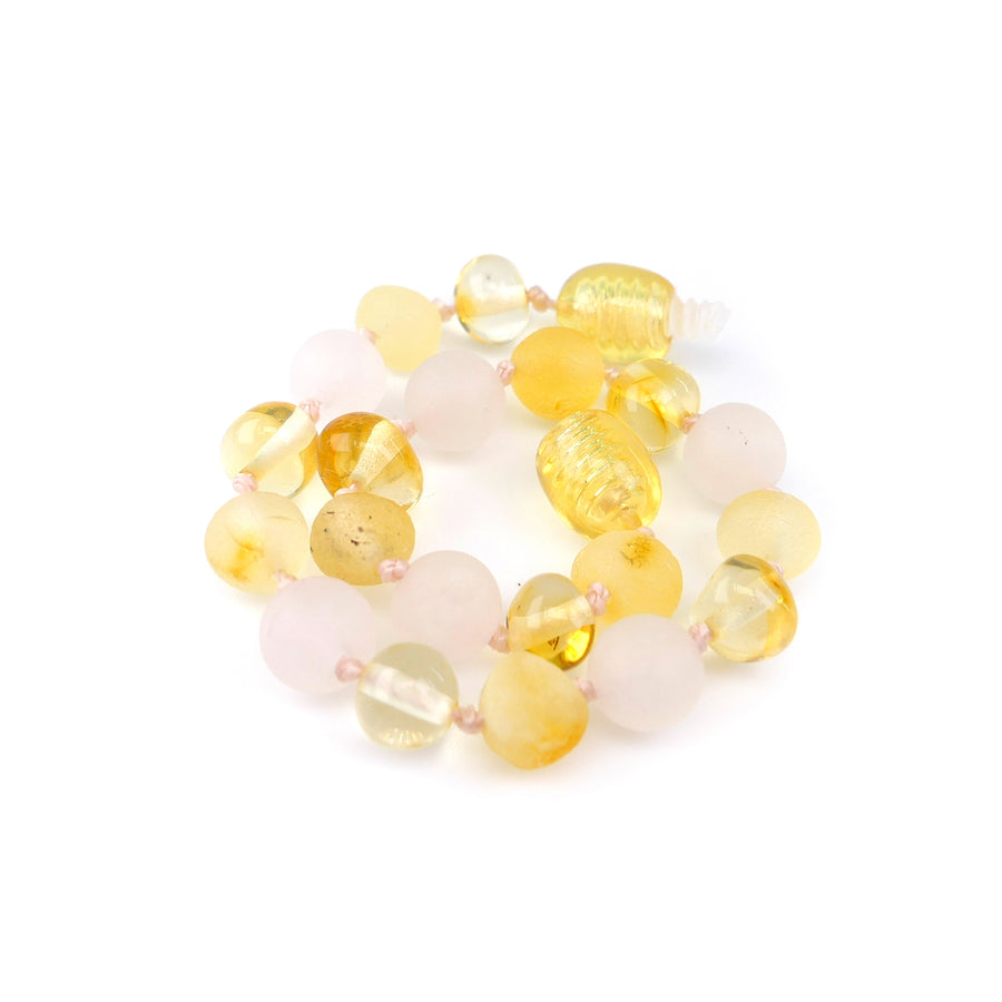 Pulsera calmante de ámbar natural color miel con cuentas de cuarzo rosa